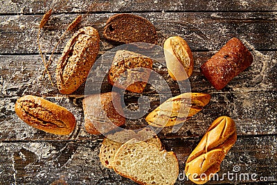 Bread loaf mixed in a rustic wood and wheat flour Stock Photo