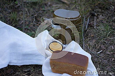 Bread and military flask on a white towel Stock Photo