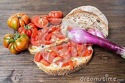 Bread, oil, tomato and Tropea onion Stock Photo