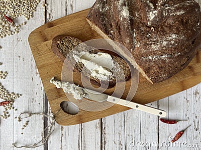 Bread and a piece of bread with butter Stock Photo