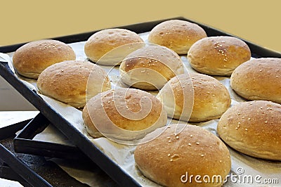 Bread rolls on a baking tray Stock Photo