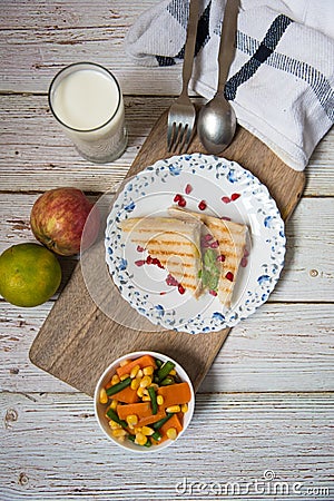 Bread sandwich milk and fruits on a background Stock Photo