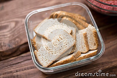 Bread soaked in milk for making meatballs Stock Photo