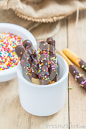 Bread sticks with chocolate and colorful sprinkles for children, Snack for kids Stock Photo