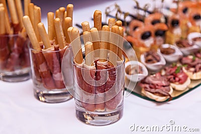Bread sticks with a prosciutto in a glass Stock Photo