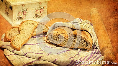 Bread wrapped in cloth, bread slices, rolling pin, decoupage box. Stock Photo