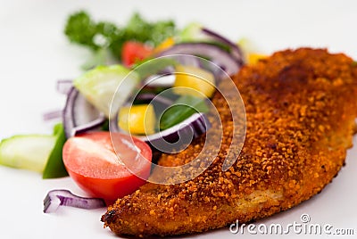 Breaded chicken breast with vegetables Stock Photo