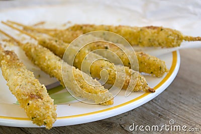 Breaded fish skewers Stock Photo