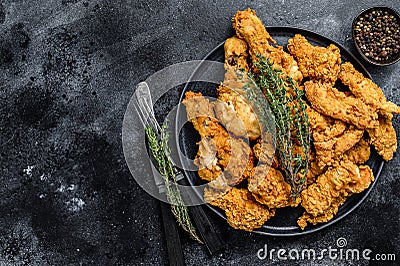 Breaded Fried Crispy Various Chicken. Black background. Top view. Copy space Stock Photo