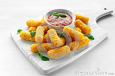 Breaded mozzarella cheese sticks with tomato basil sauce Stock Photo