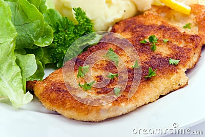 Breaded pork chop with lettuce Stock Photo