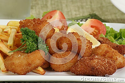 Breaded scampi and chips Stock Photo