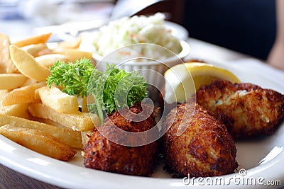 Breaded scampi tails with salad leaves Stock Photo