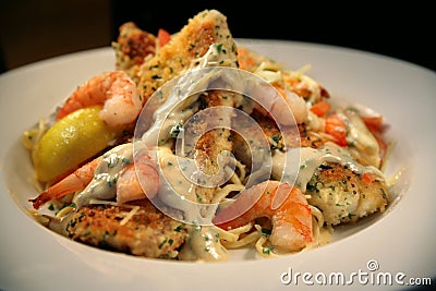 Breaded White Fish and Shrimp Spaghetti Stock Photo