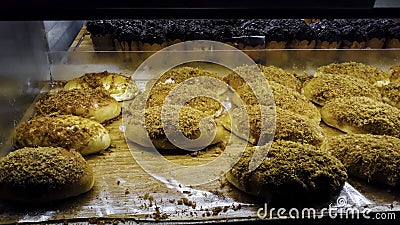 Breads and baked goods large assortment in bakery shelves with fresh baked crispy bread organic Stock Photo