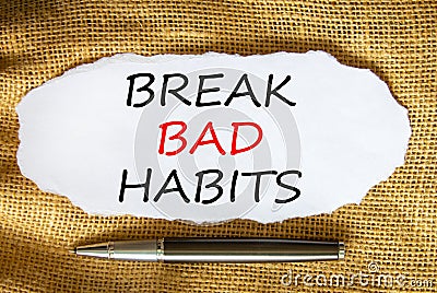 Break bad habits symbol. Words `Break bad habits` on white paper. Black metallic pen. Beautiful canvas background. Business, Stock Photo