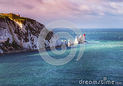 The Needles and the 19th century lighthouse on the coastline Isle of Wight Stock Photo