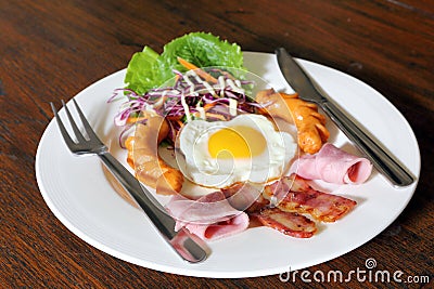 Breakfast with bacon, fried egg,sausages on grunge Stock Photo