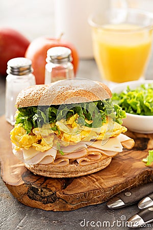 Breakfast bagel with scrambled eggs and turkey Stock Photo