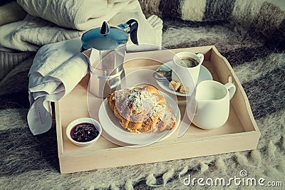 Breakfast in bed - coffee, croissant, milk on tray Stock Photo