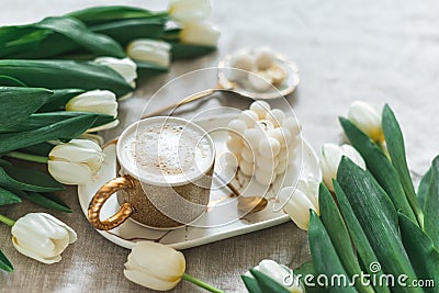 Breakfast in bed, cup of cappuccino, flowers Stock Photo