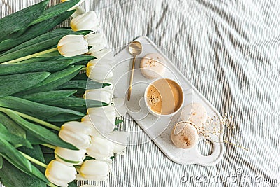 Breakfast in bed, cup of cappuccino, flowers Stock Photo