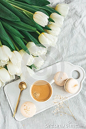 Breakfast in bed, cup of cappuccino, flowers Stock Photo