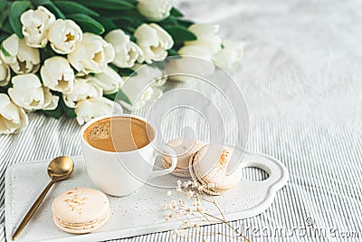 Breakfast in bed, cup of cappuccino, flowers Stock Photo