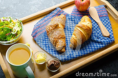 Breakfast in bed on wood tray Stock Photo