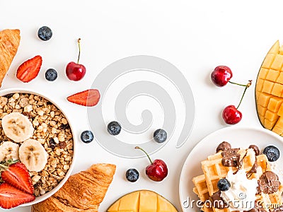 Breakfast berries and oatmeal frame with copy space. Waffle with mango, croissant and cherries. Flat lay top view Stock Photo