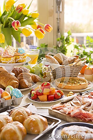 Table with delicatessen ready for Easter brunch Stock Photo