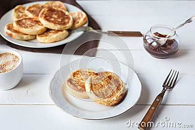 Breakfast with cheese pancakes, coffee and jam Stock Photo