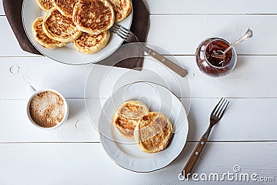 Breakfast with cheese pancakes, coffee and jam Stock Photo