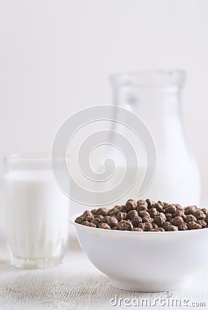 Breakfast: chocolate balls, fresh cows milk Stock Photo