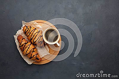 Breakfast - coffee and sweet croissant with chocolate. Stock Photo