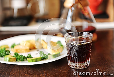 Breakfast with coffee. Trendy old fashioned crystal glass. Japanese omelet with avocado and greens on white plate. Manual Stock Photo