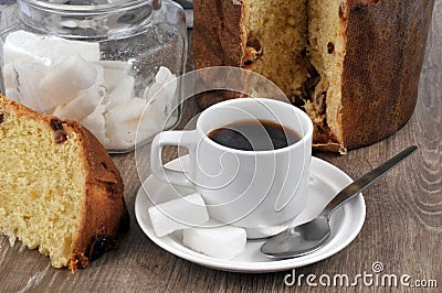 Cup of coffee and a slice of panettone close up Stock Photo