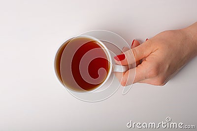 Hand with cup of tea. Stock Photo