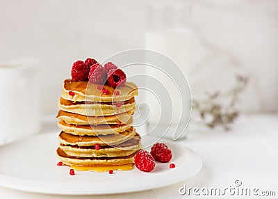 Plate with delicious pancakes with raspberries and honey on white background. Stock Photo