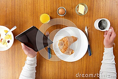 Breakfast food and man holding tablet and coffee Stock Photo