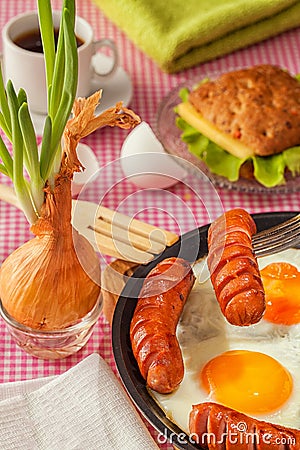 Breakfast of fried eggs and sausages Stock Photo