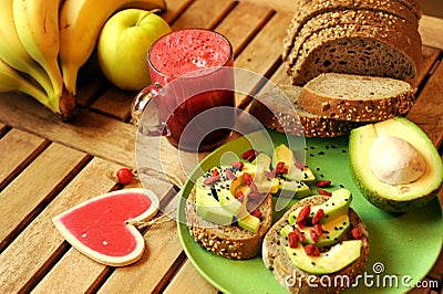 Breakfast with fruit juice and avocado sandwich Stock Photo