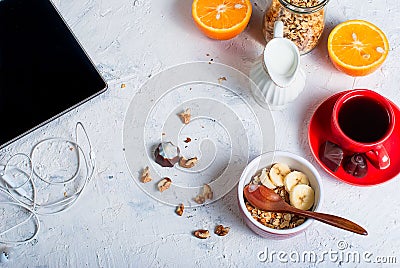 Breakfast granola, a cup of coffee and phone Stock Photo