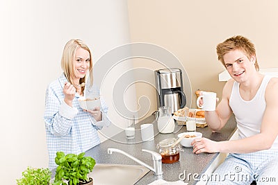 Breakfast happy couple eat cereal drink coffee Stock Photo