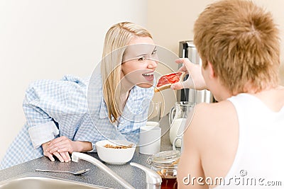 Breakfast happy couple man feed woman toast Stock Photo