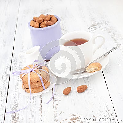 Breakfast with homemade cookies, apple and almond with cup of te Stock Photo