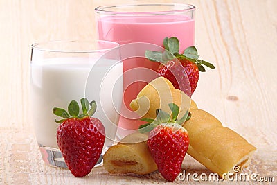 Breakfast with milk, strawberry smoothie and afternoon snack Stock Photo