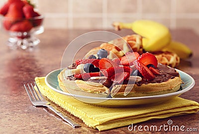 Breakfast of mixed fruit waffle with chocolate spread Stock Photo