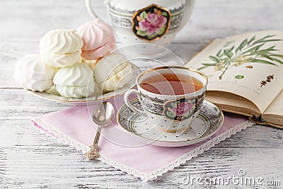 Breakfast in the morning with books and tea in china teacup Stock Photo