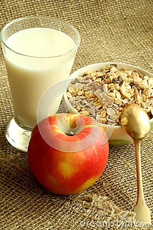 Breakfast, muesli apple and glass of milk Stock Photo